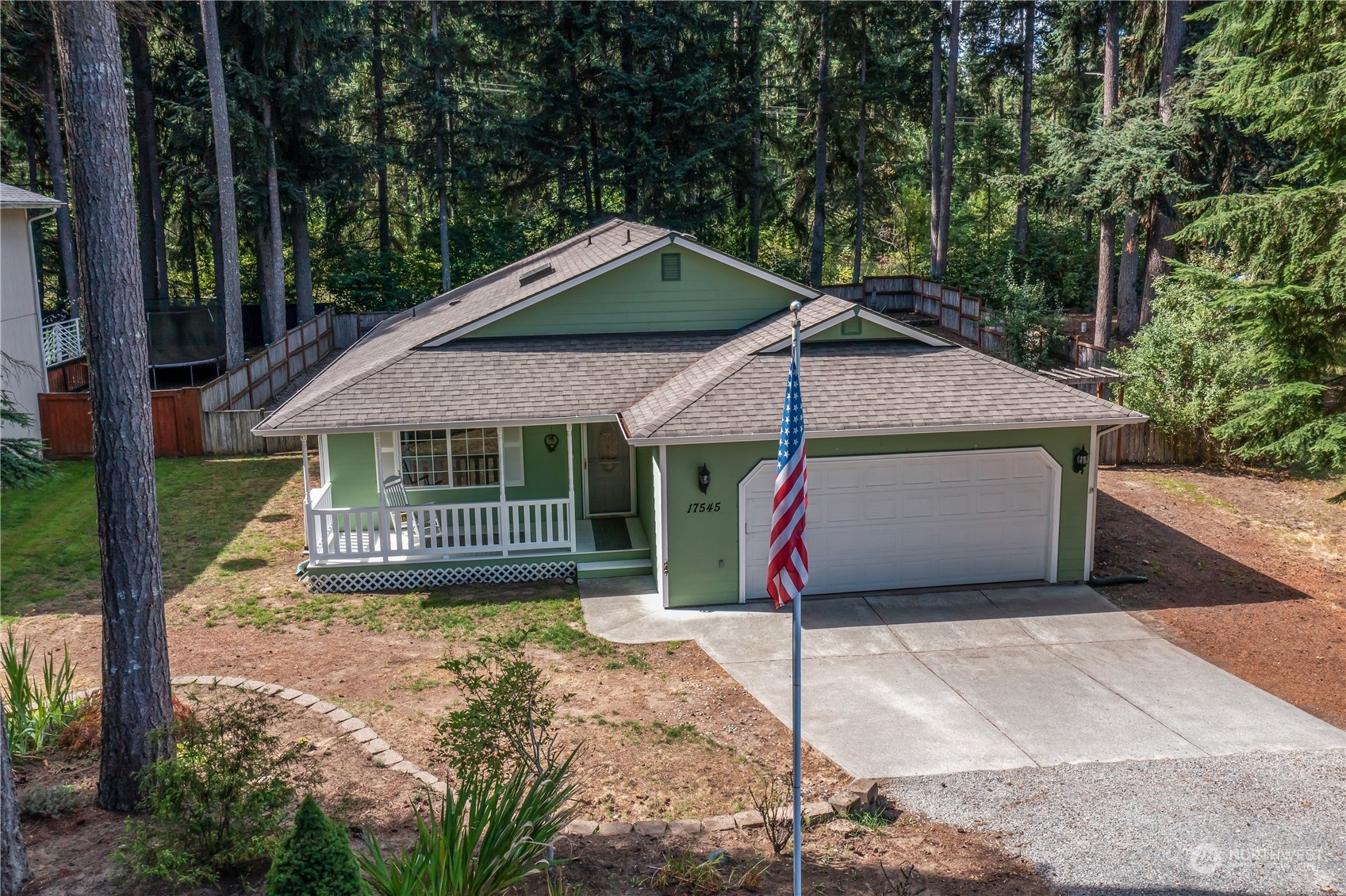 17545 Loop Lane Southeast Yelm, WA 98597 - Photo 2 of 35 a view of a house with a yard and large tree