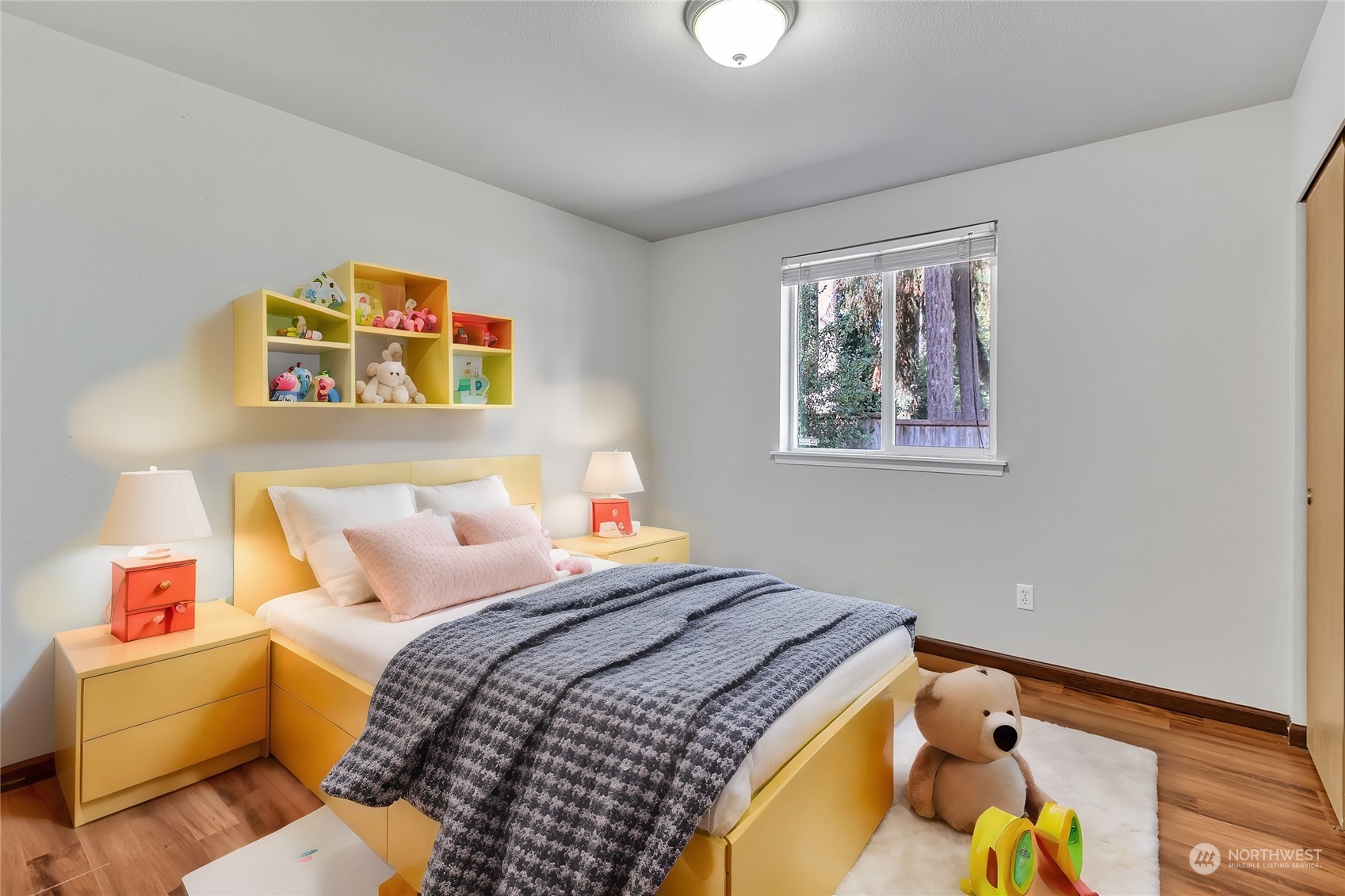 17545 Loop Lane Southeast Yelm, WA 98597 - Photo 21 of 35 a bedroom with bed and a window