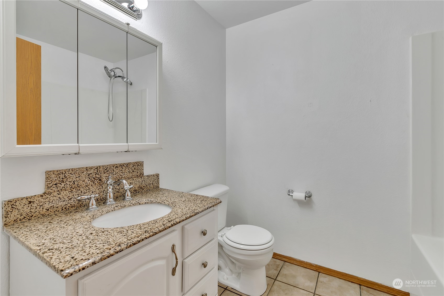 17545 Loop Lane Southeast Yelm, WA 98597 - Photo 23 of 35 a bathroom with a granite countertop sink toilet and a mirror