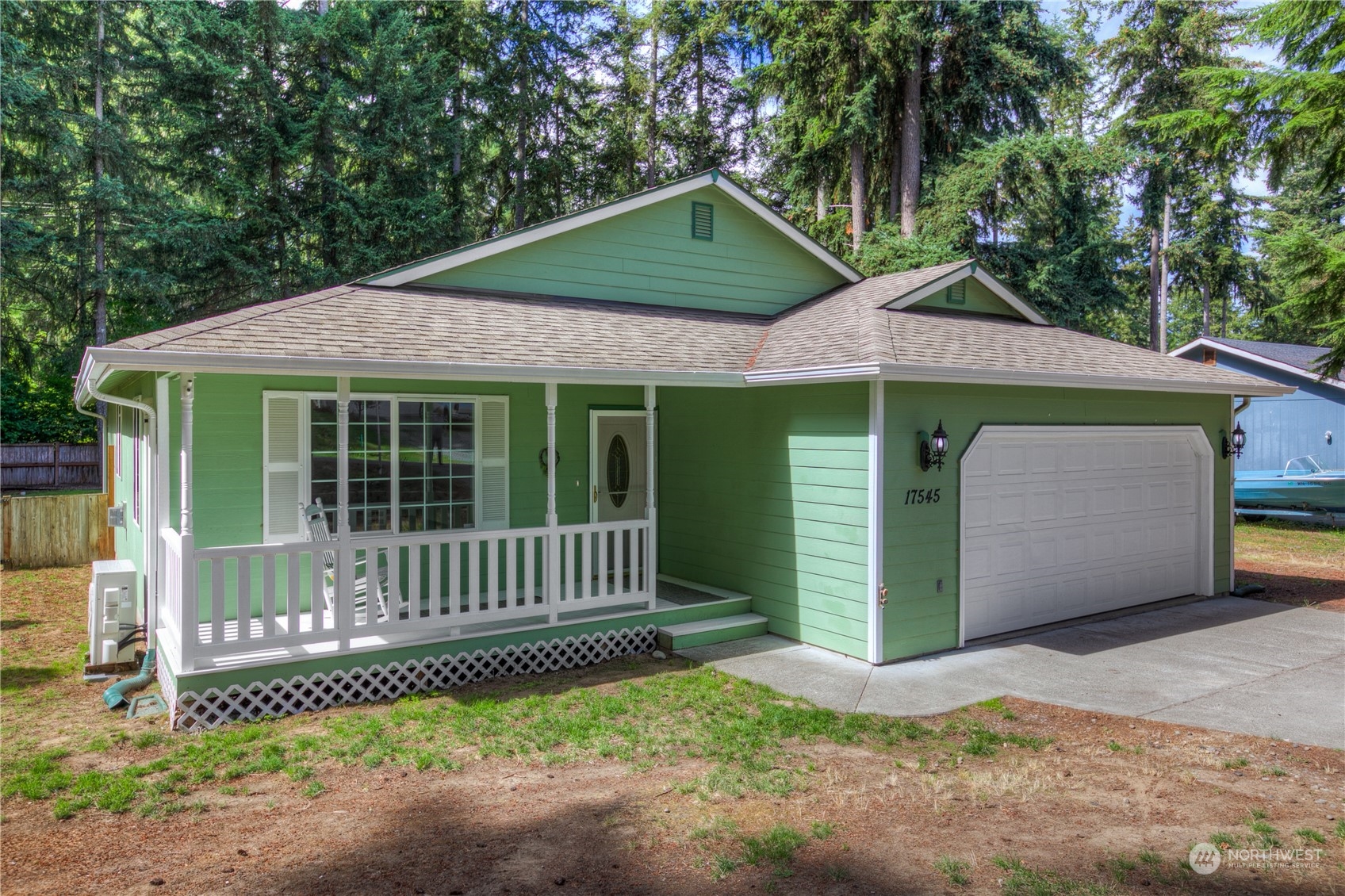17545 Loop Lane Southeast Yelm, WA 98597 - Photo 3 of 35 a front view of a house with a garden