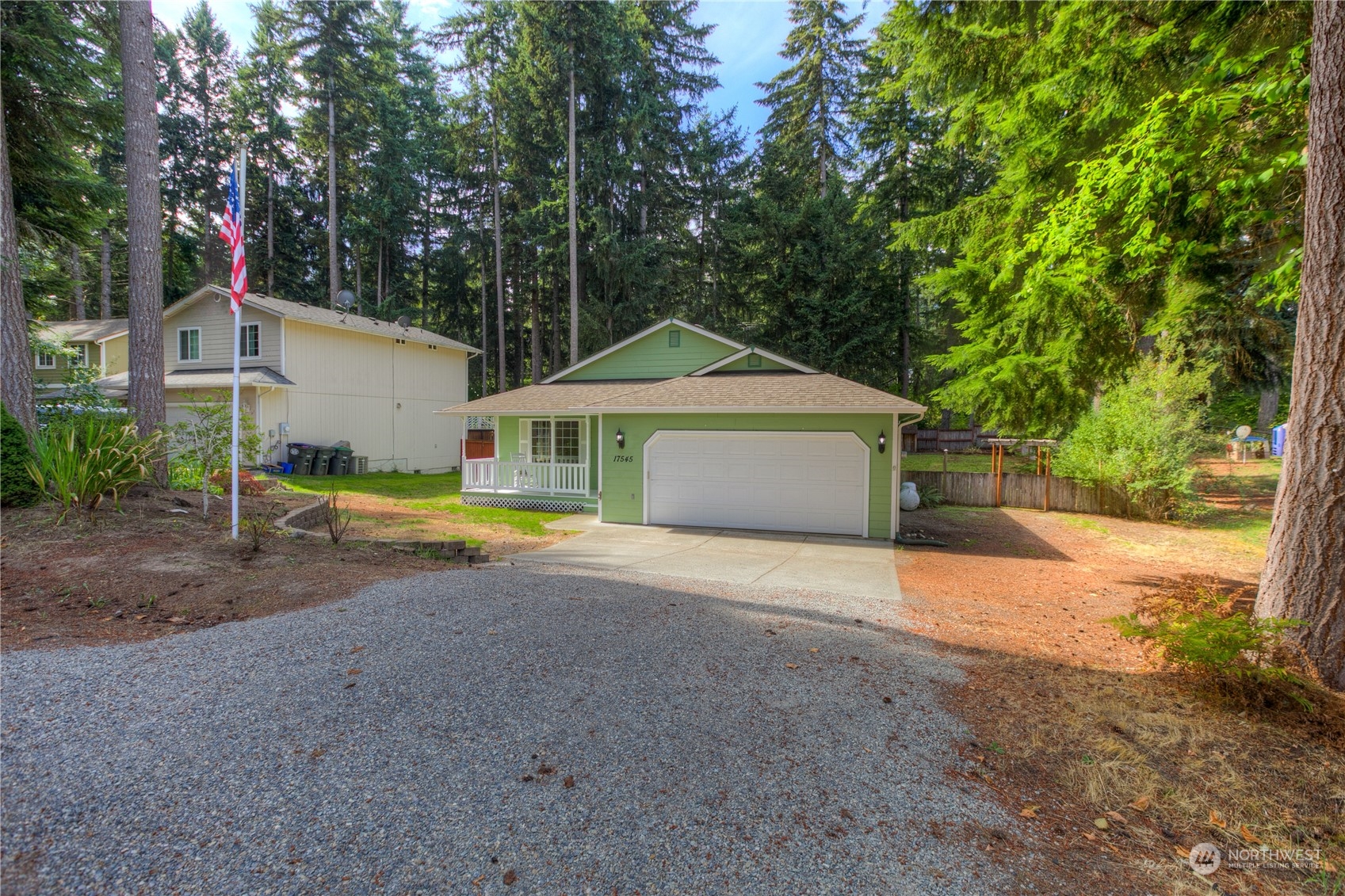 17545 Loop Lane Southeast Yelm, WA 98597 - Photo 31 of 35 a view of a house with a yard and large trees