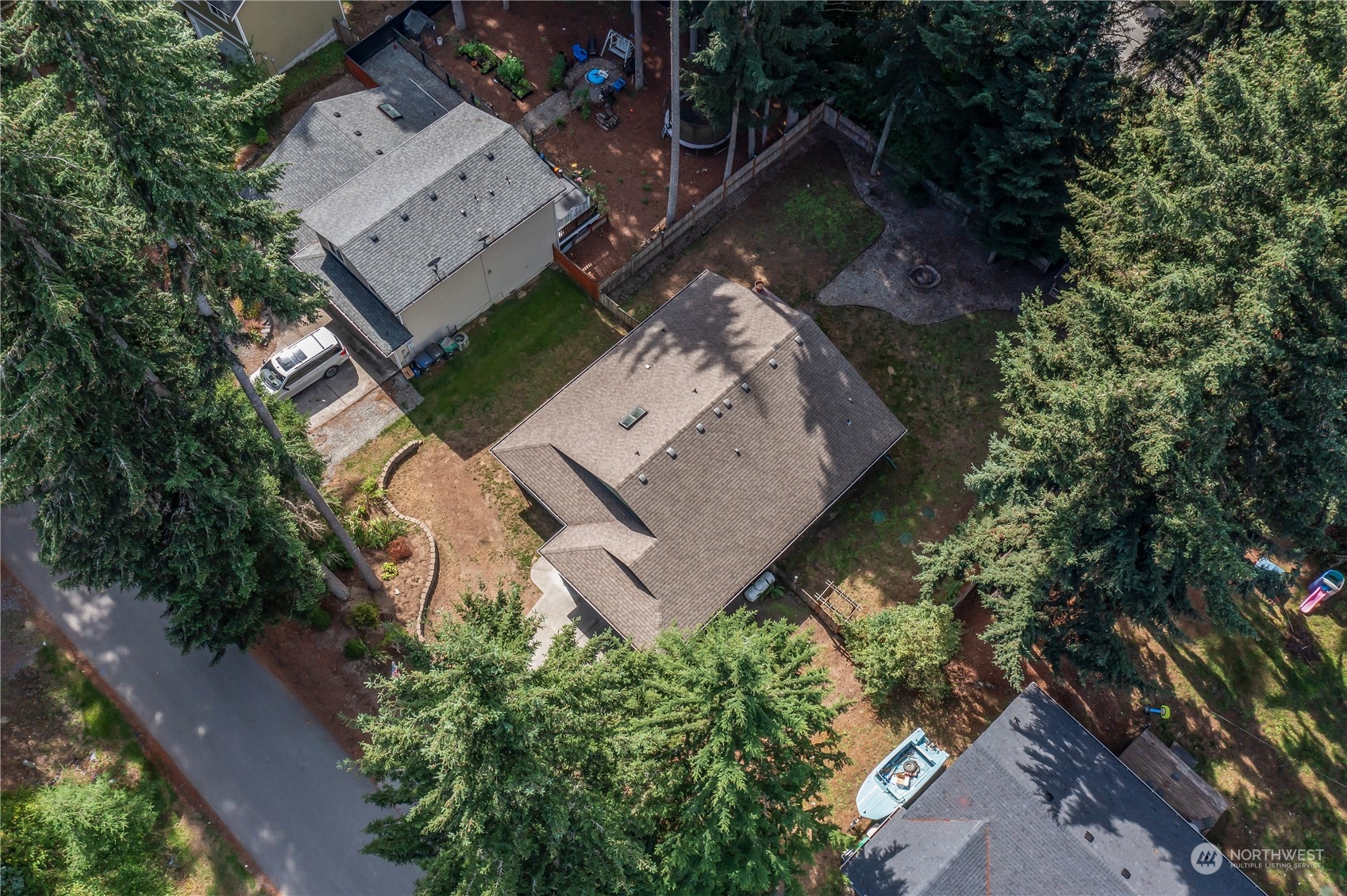 17545 Loop Lane Southeast Yelm, WA 98597 - Photo 32 of 35 an aerial view of a house with a yard and garden