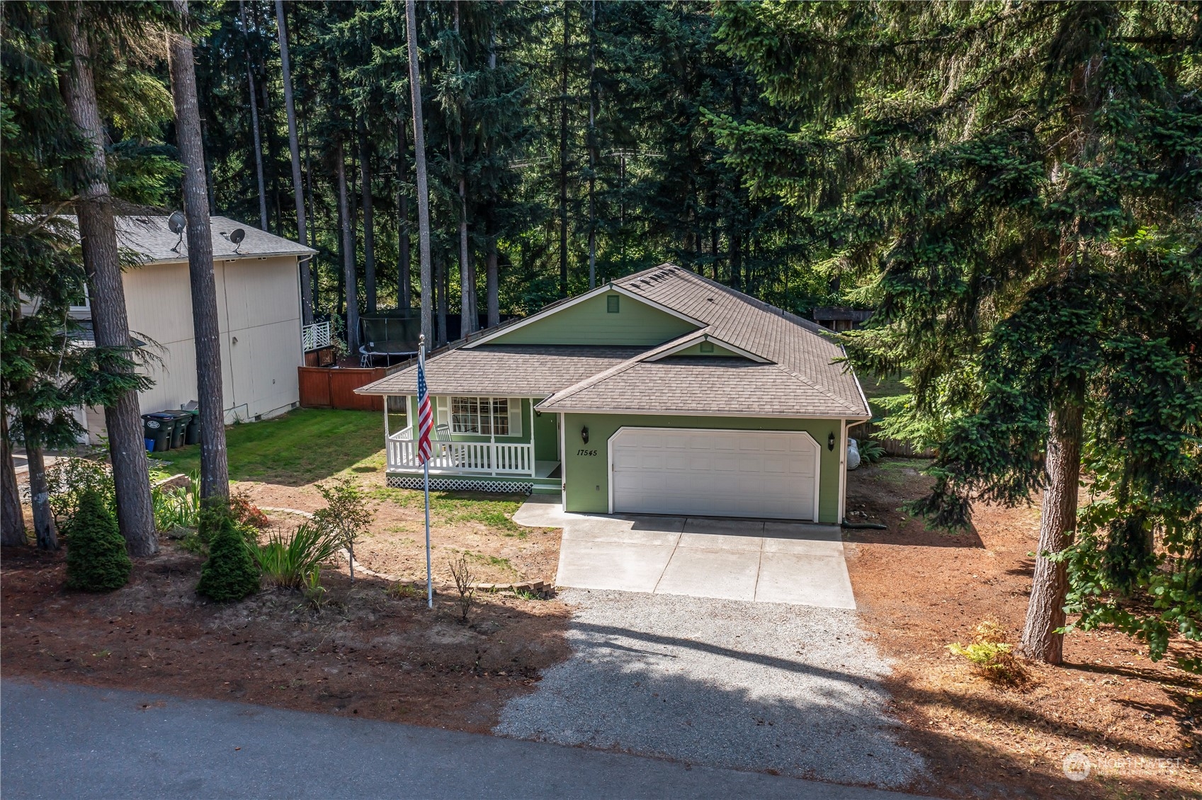 17545 Loop Lane Southeast Yelm, WA 98597 - Photo 33 of 35 a front view of a house with garden