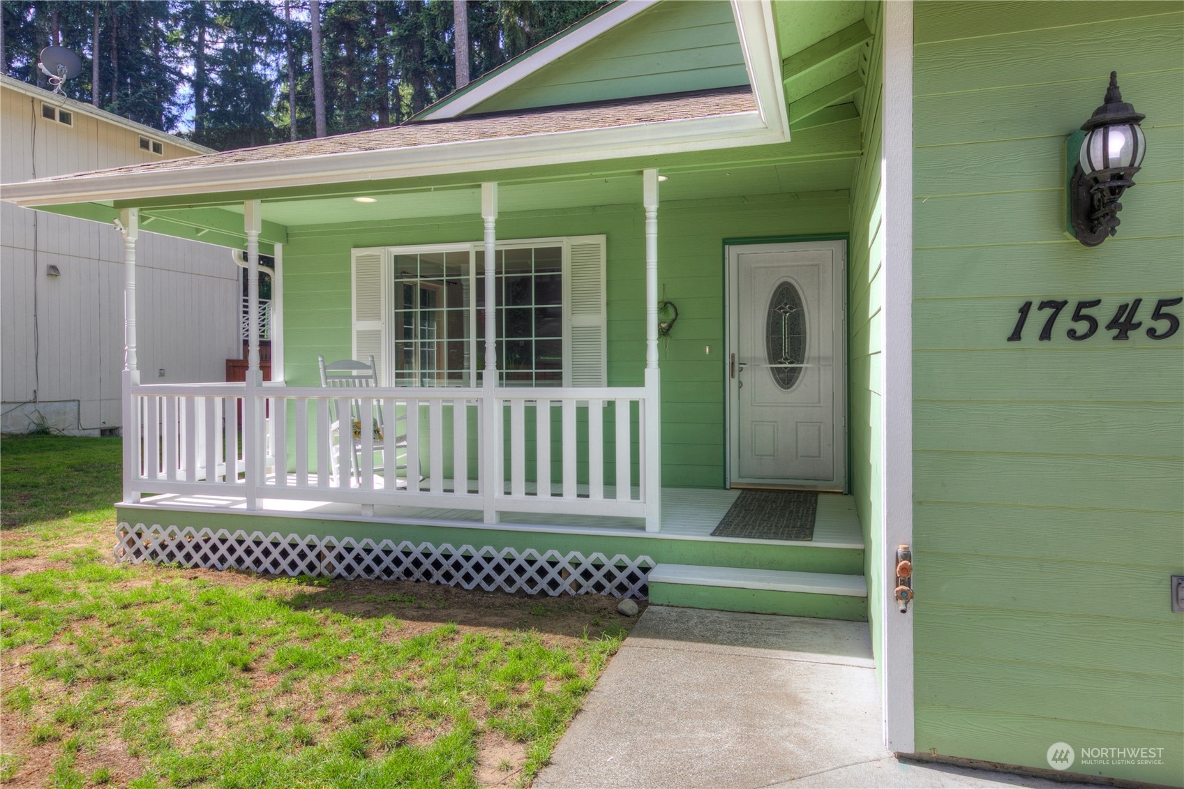 17545 Loop Lane Southeast Yelm, WA 98597 - Photo 4 of 35 a front view of a house with a yard