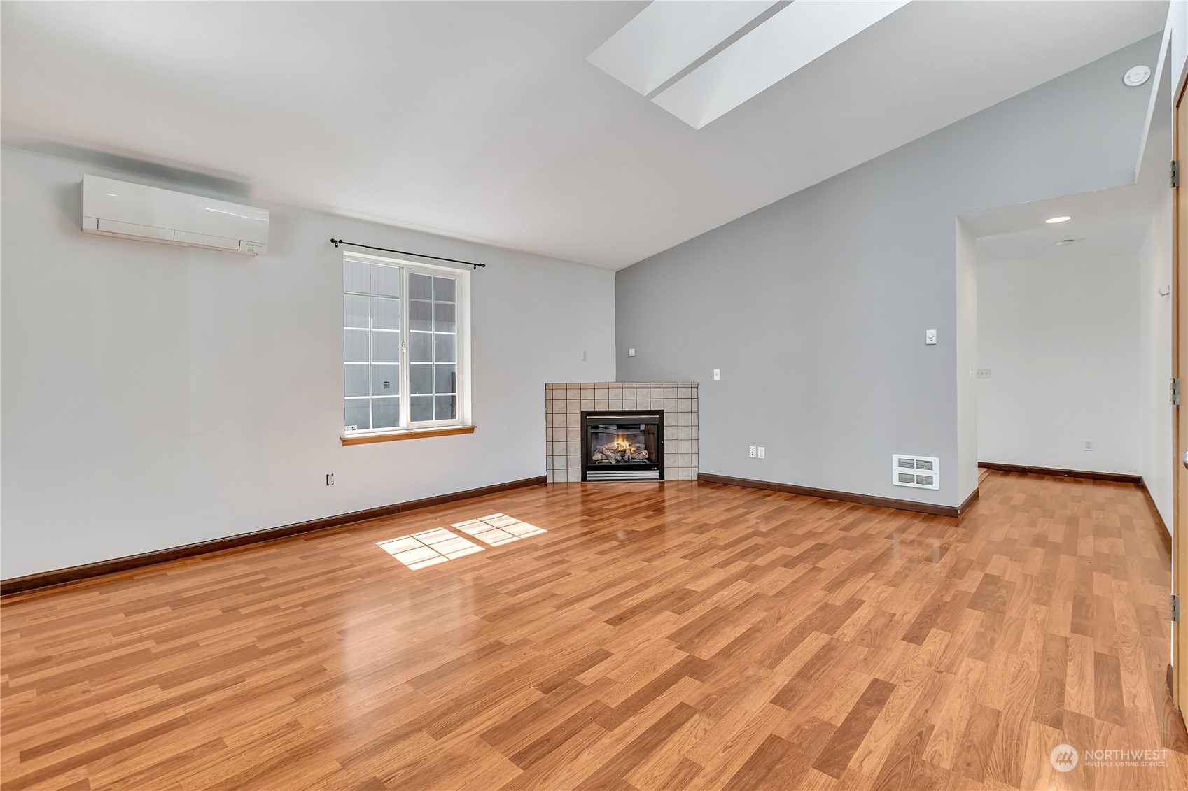 17545 Loop Lane Southeast Yelm, WA 98597 - Photo 6 of 35 a view of an empty room with wooden floor and a window