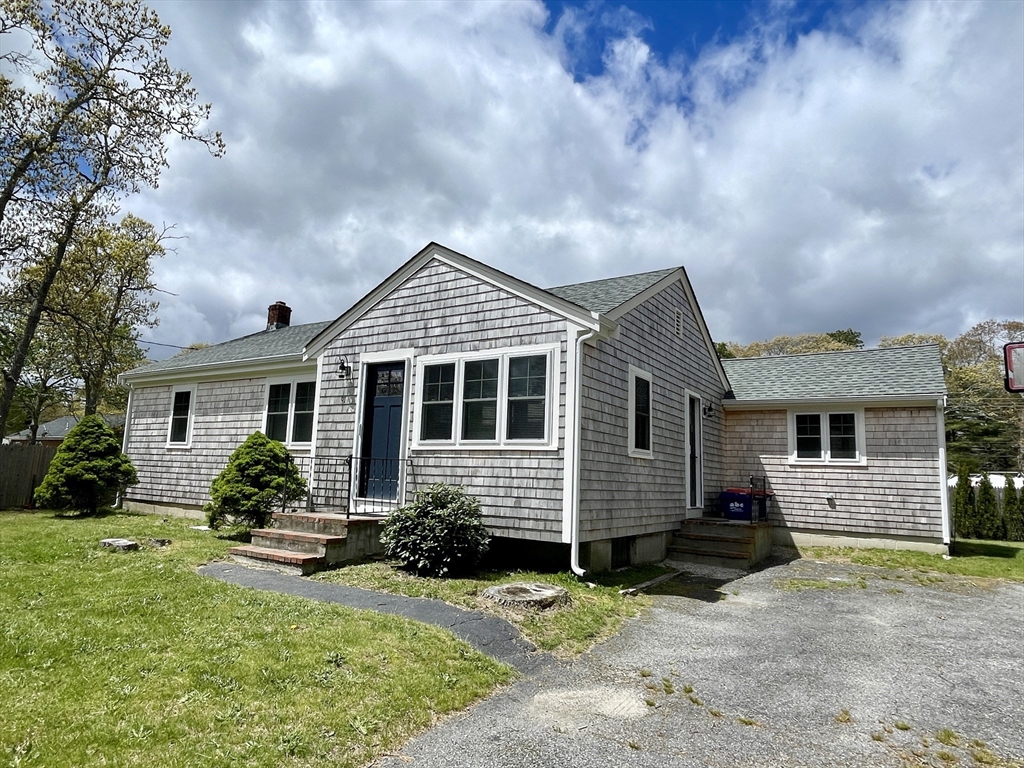 91 Martin Street Wareham, MA 02532 - Photo 1 of 25 a front view of a house with a yard