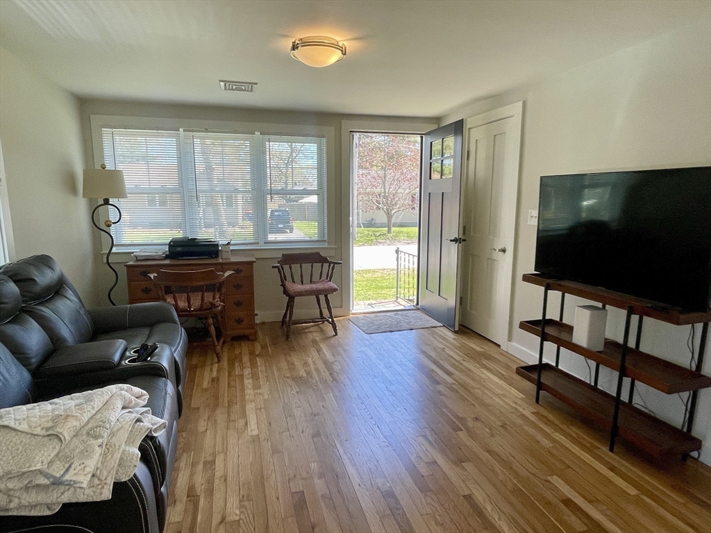 91 Martin Street Wareham, MA 02532 - Photo 13 of 25 a living room with furniture and a flat screen tv