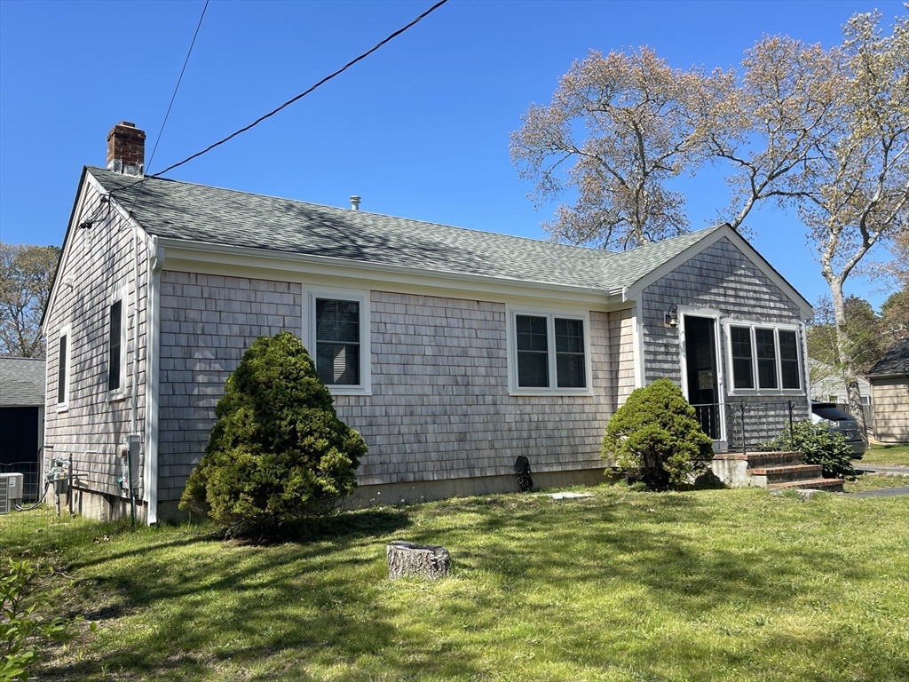 91 Martin Street Wareham, MA 02532 - Photo 4 of 25 a front view of a house with a garden