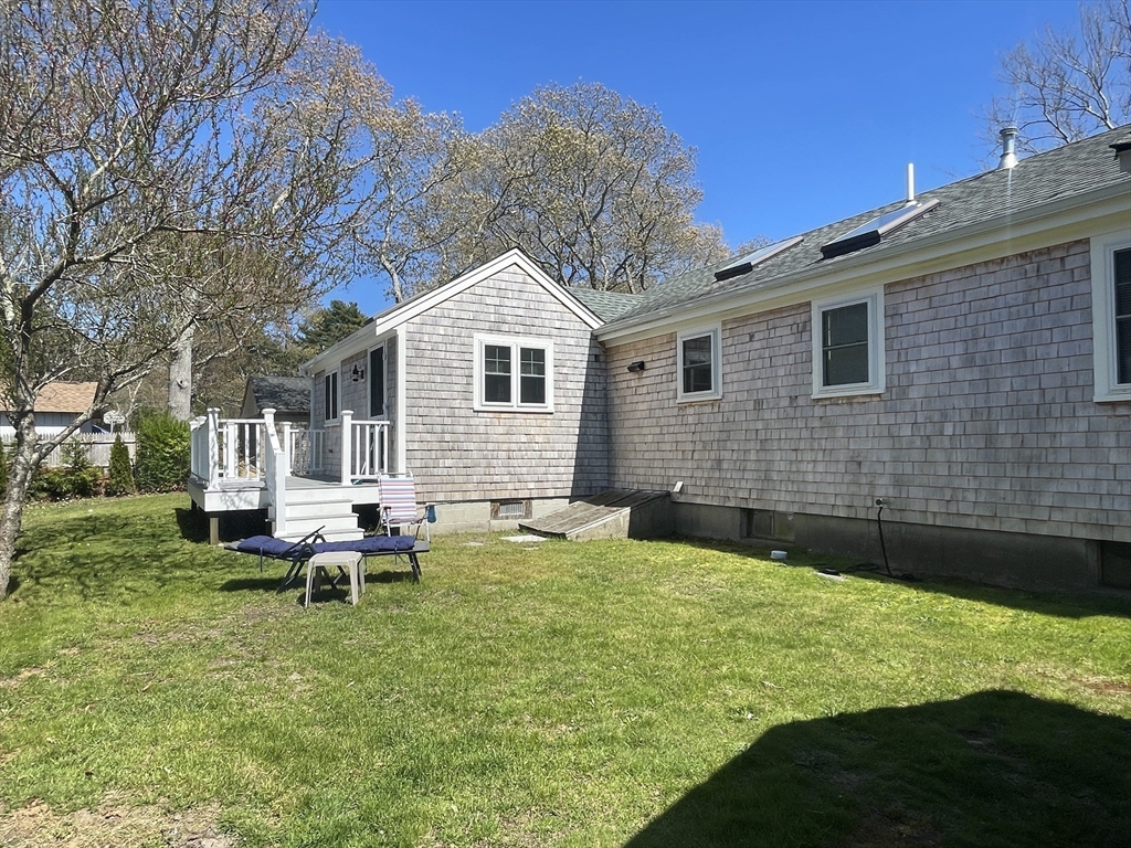 91 Martin Street Wareham, MA 02532 - Photo 5 of 25 a backyard of a house with table and chairs