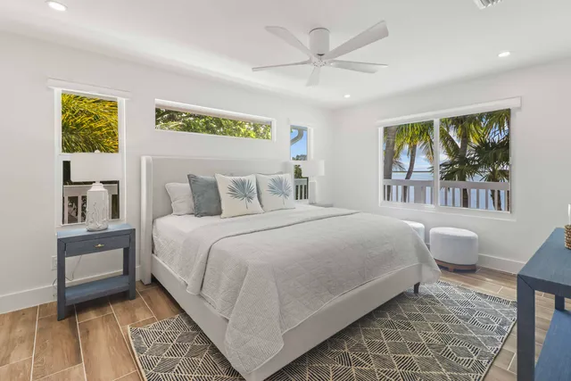 a bedroom with a large bed and a window