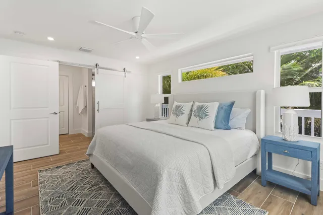 a spacious bedroom with a bed and a couch