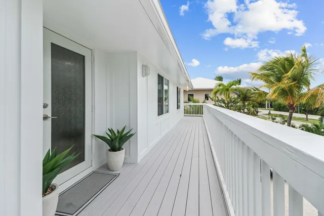 a view of a balcony with wooden floor