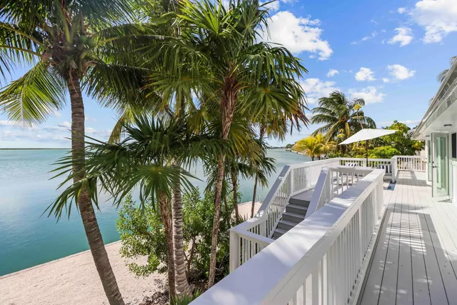 a living room with furniture a rug and a window