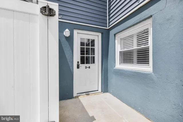 a view of a hallway to a window