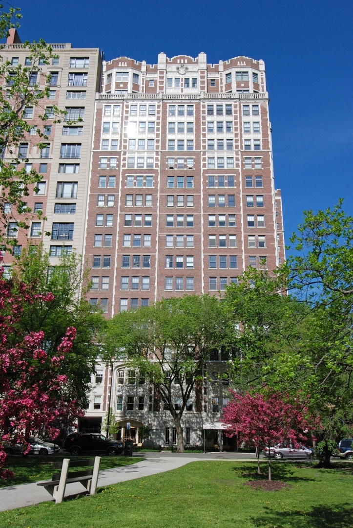 2440 North Lakeview Avenue, Unit 8F Chicago, IL 60614 - Photo 1 of 1 a large building with a yard in front of it