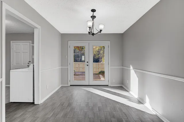 a view of an entryway with wooden floor