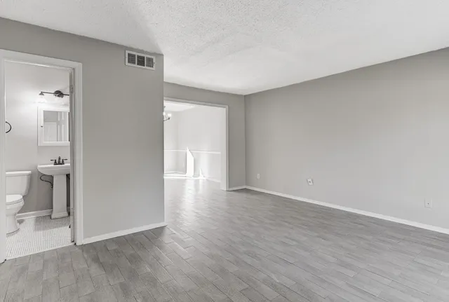 a view of an empty room and glass door