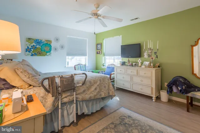 a bathroom with a double vanity sink mirror and toilet