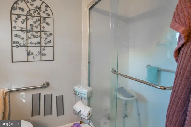 a bed room with a bed and a chair