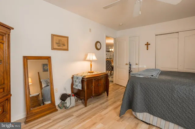 a room with a flat screen tv and a refrigerator