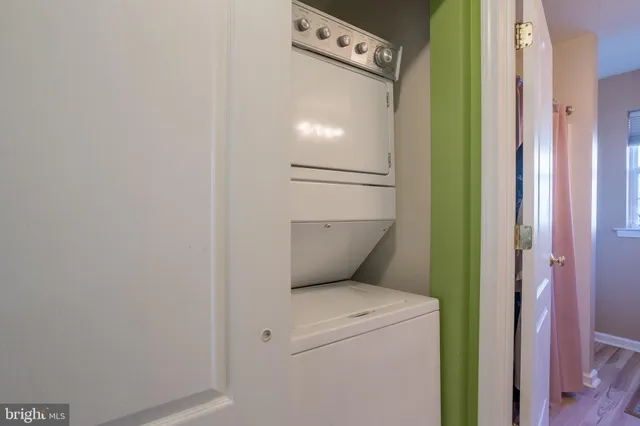 a view of city street with a car parked in front of it