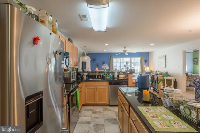 a view of a dining room with furniture and a chandelier
