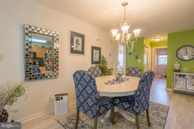 a living room with lots of furniture and kitchen view
