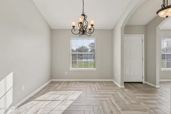 a view of room with window and hardwood floor