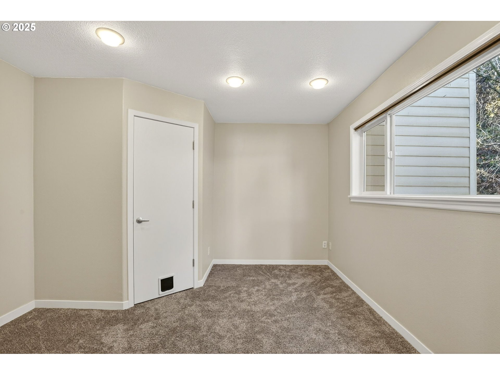 3515 Southwest Barbur Boulevard, Unit R2 Portland, OR 97239 - Photo 18 of 35 a view of an empty room with a window