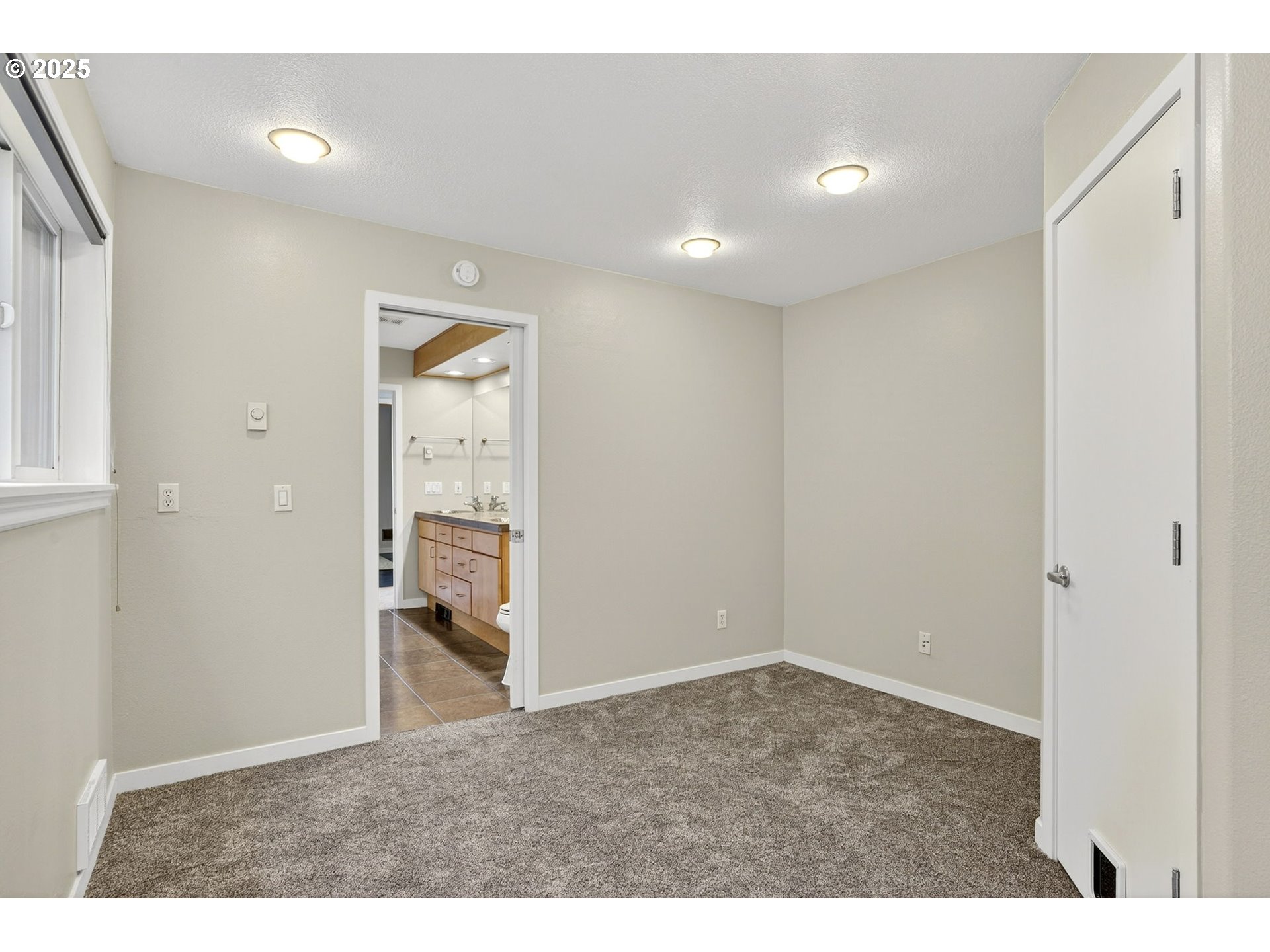 3515 Southwest Barbur Boulevard, Unit R2 Portland, OR 97239 - Photo 20 of 35 a view of an empty room with wooden floor