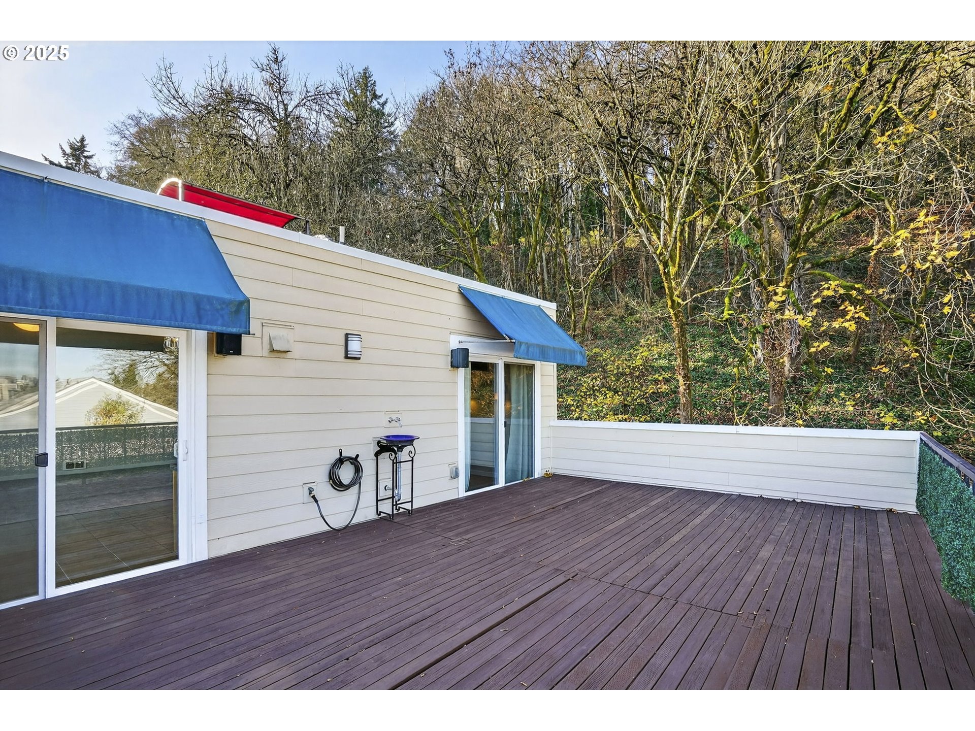 3515 Southwest Barbur Boulevard, Unit R2 Portland, OR 97239 - Photo 30 of 35 a view of a house with a deck