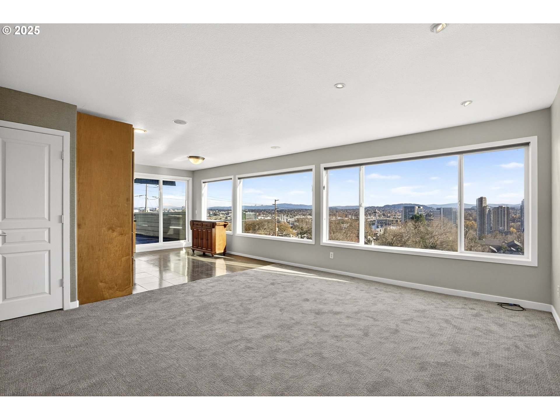 3515 Southwest Barbur Boulevard, Unit R2 Portland, OR 97239 - Photo 7 of 35 a big room with wooden floor and a floor to ceiling window