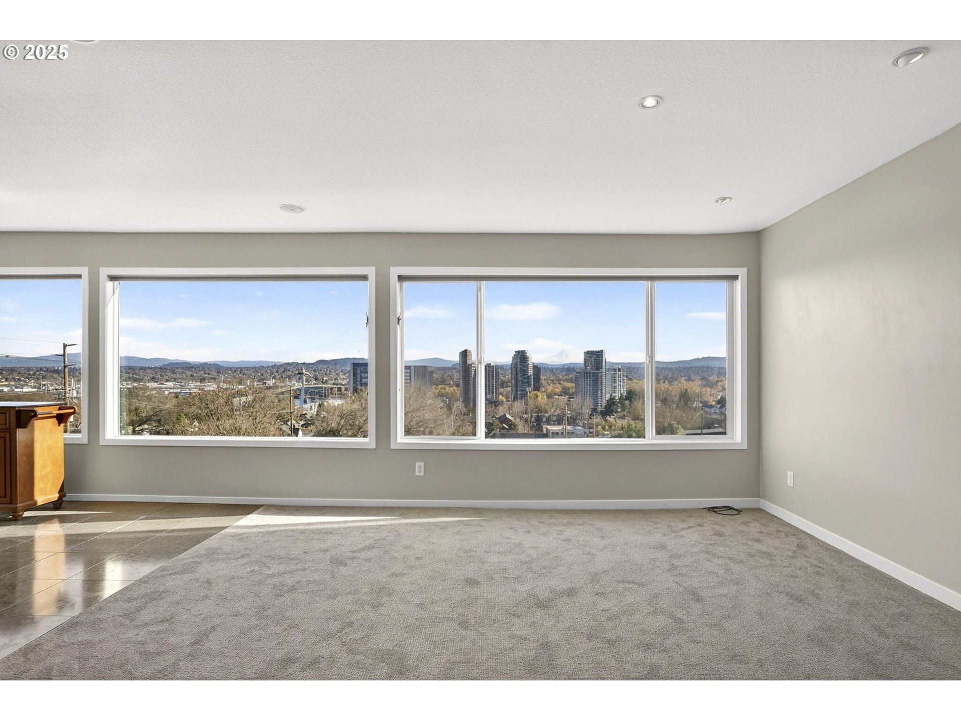 3515 Southwest Barbur Boulevard, Unit R2 Portland, OR 97239 - Photo 8 of 35 a view of an empty room with a window