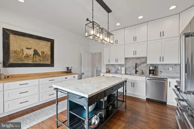 an aerial view of a house with a big yard