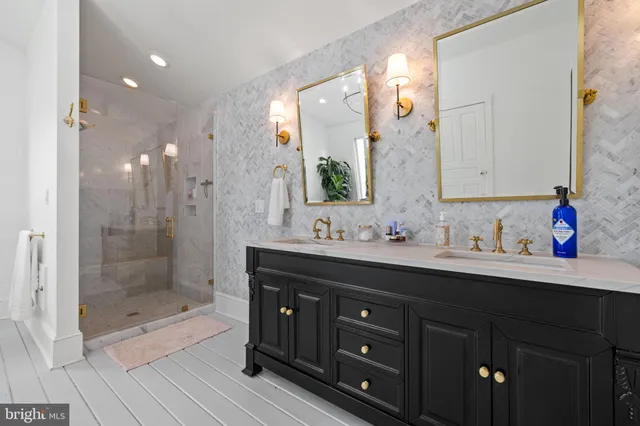 a view of an apartment with a large tree and flower plants