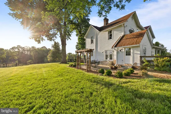 a view of a house with a big yard