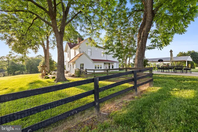 a view of swimming pool with an outdoor space and seating area