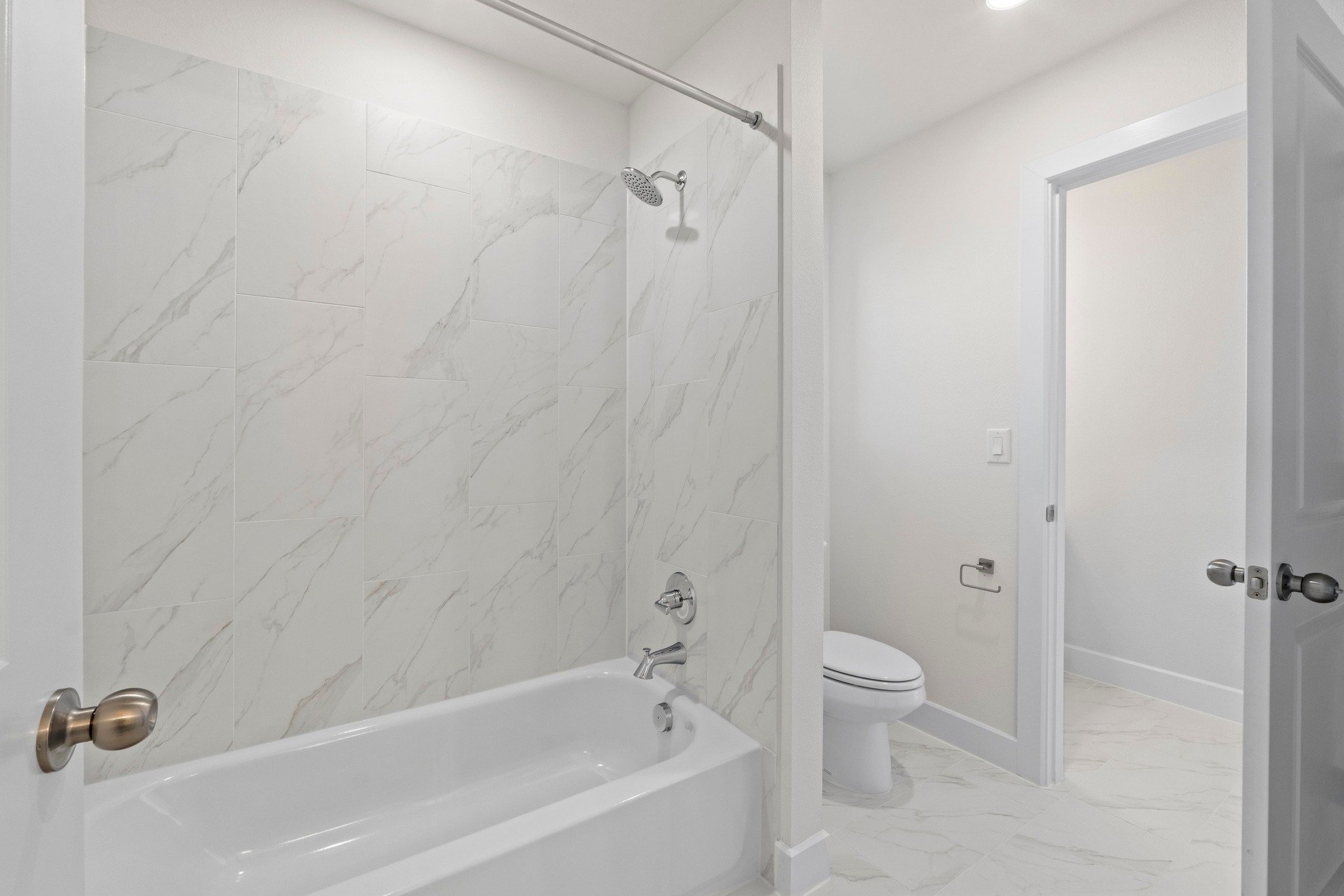 604 Lightstone Drive Georgetown, TX 78633 - Photo 26 of 39 a bathroom with a bathtub toilet and shower