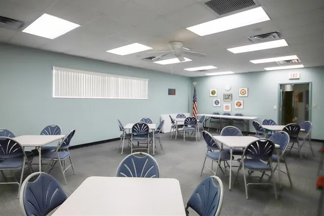 a view of a dining room and hall with furniture
