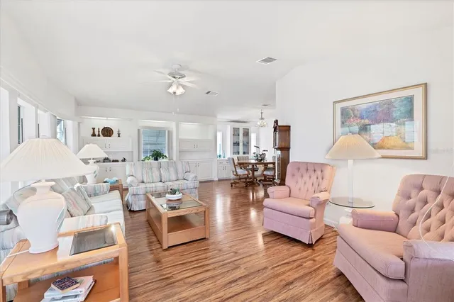 a living room with furniture or wooden floor and a lamp
