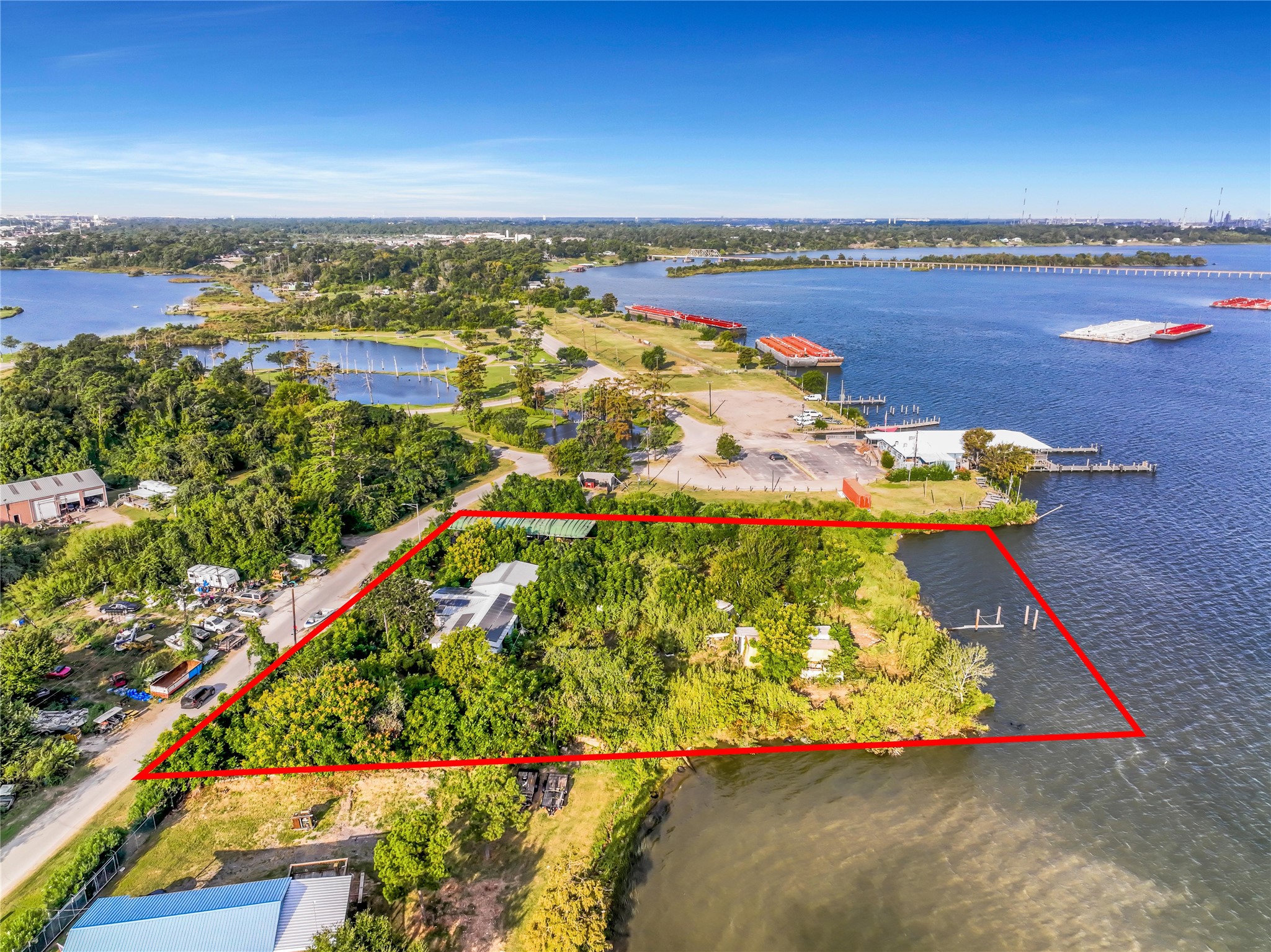 17512 River Road Channelview, TX 77530 - Photo 16 of 27 an aerial view of a house with a yard and lake view