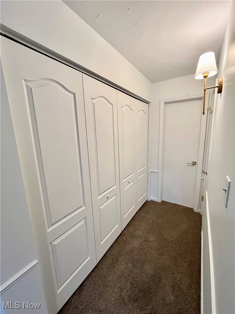 22701 Center Ridge Road, Unit 201 Rocky River, OH 44116 - Photo 28 of 37 Hallway with dark carpet