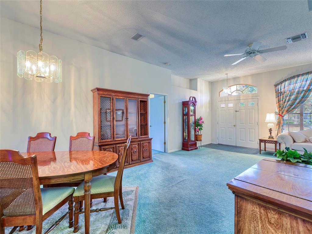 11228 Windrush Circle Hudson, FL 34667 - Photo 20 of 67 a view of a livingroom with furniture and window