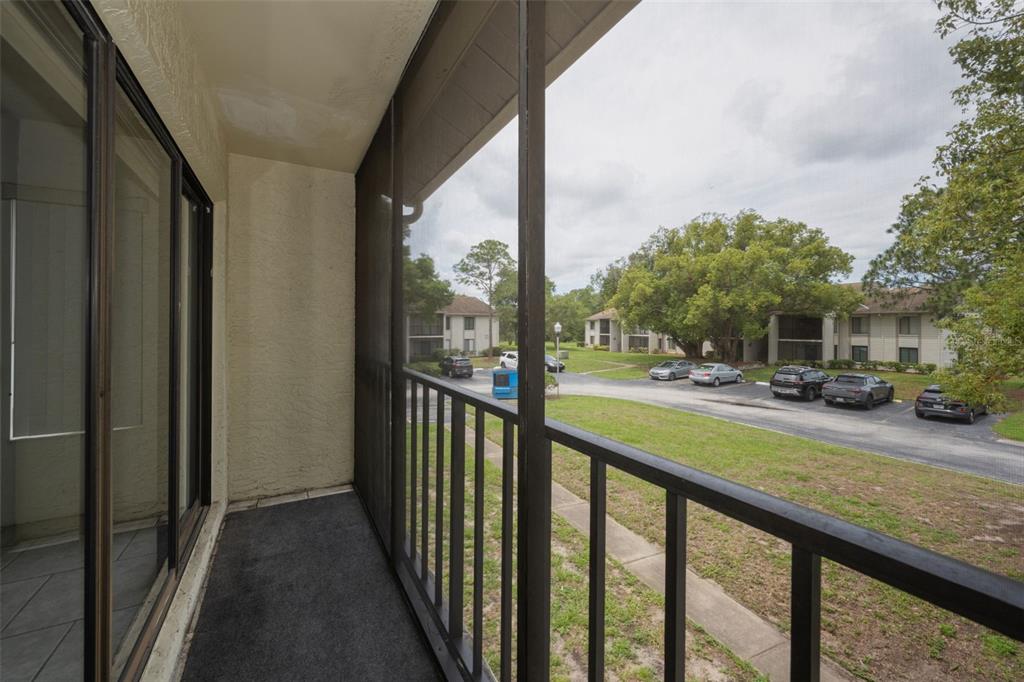 2687 Pine Ridge Way South, Unit B2 Palm Harbor, FL 34684 - Photo 30 of 68 a view of a street from a balcony