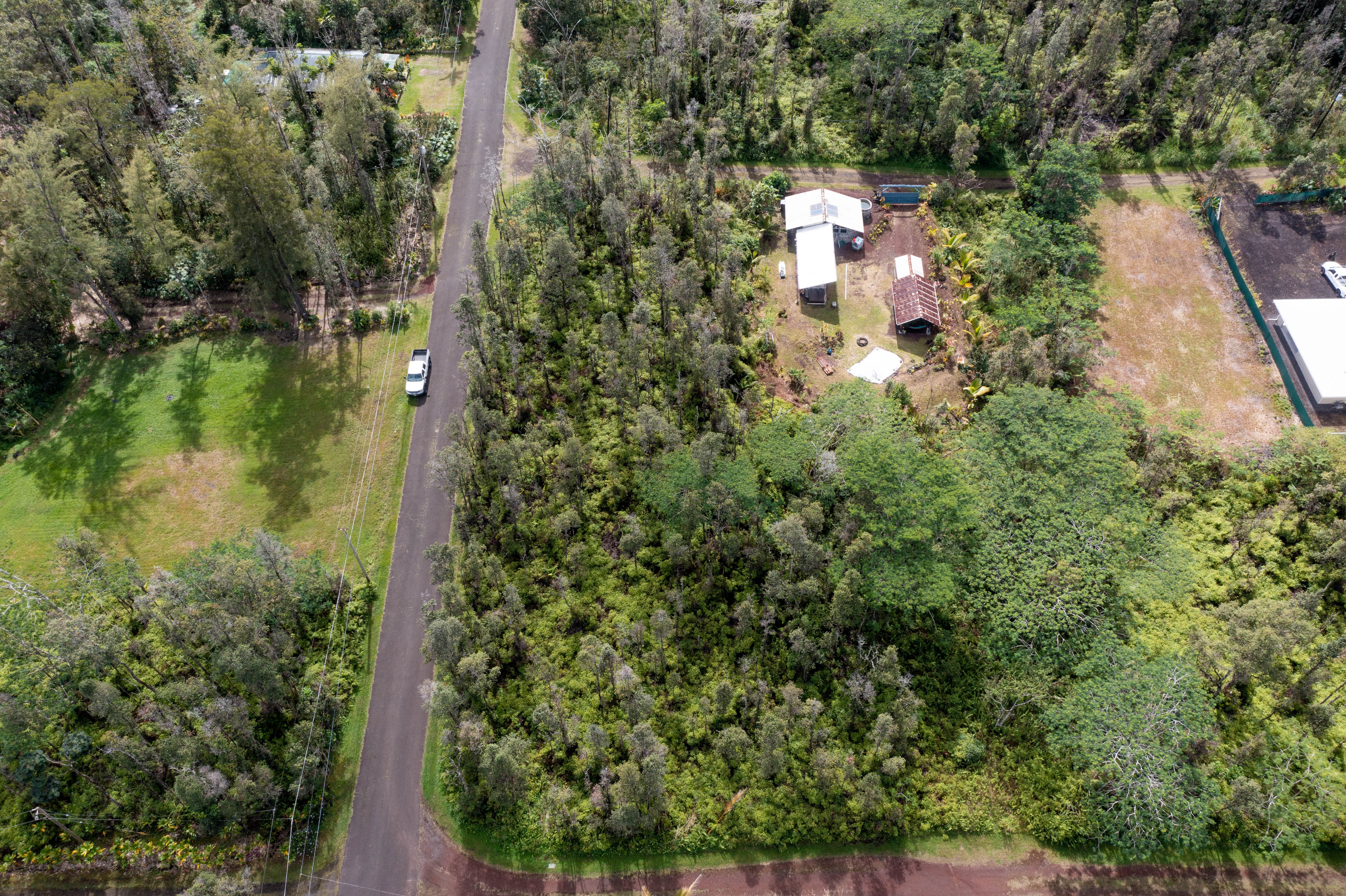 43 Seadrift Road Pahoa, HI 96778 - Photo 15 of 22 an aerial view of residential house with outdoor space and trees all around