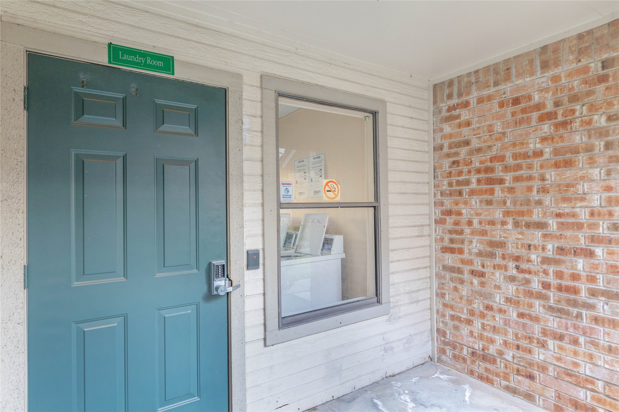 2500 Burleson Road, Unit 512 Austin, TX 78741 - Photo 13 of 16 View of exterior entry featuring brick siding