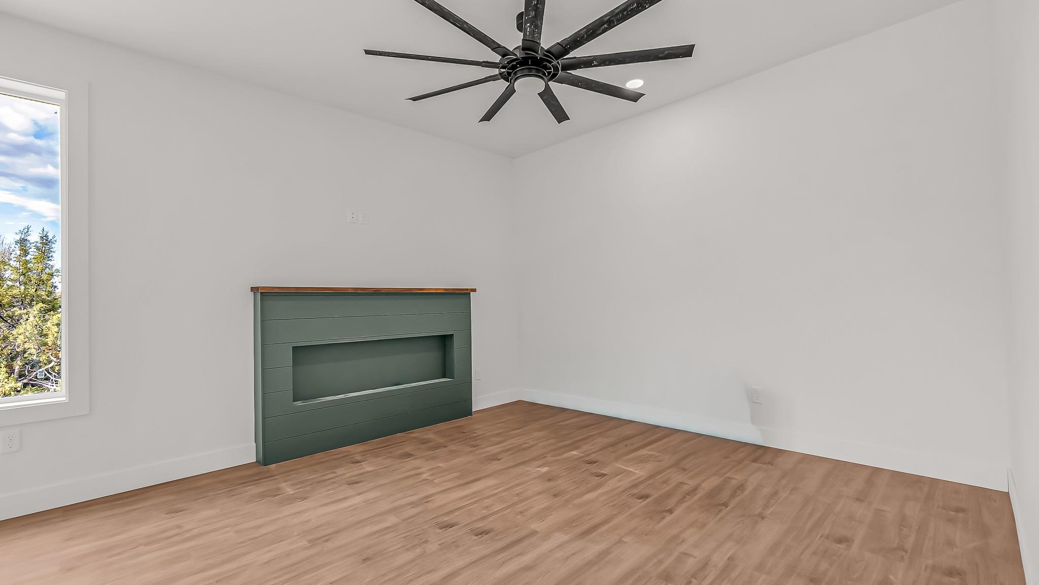 214 Limberpine Circle Parachute, CO 81635 - Photo 7 of 24 a view of empty room with window and ceiling fan