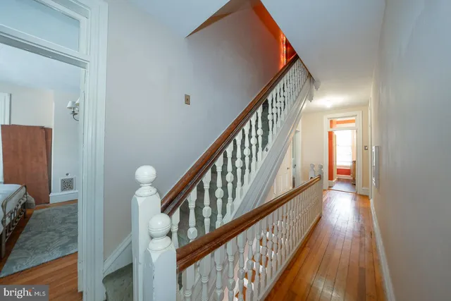 a view of an entryway with wooden floor