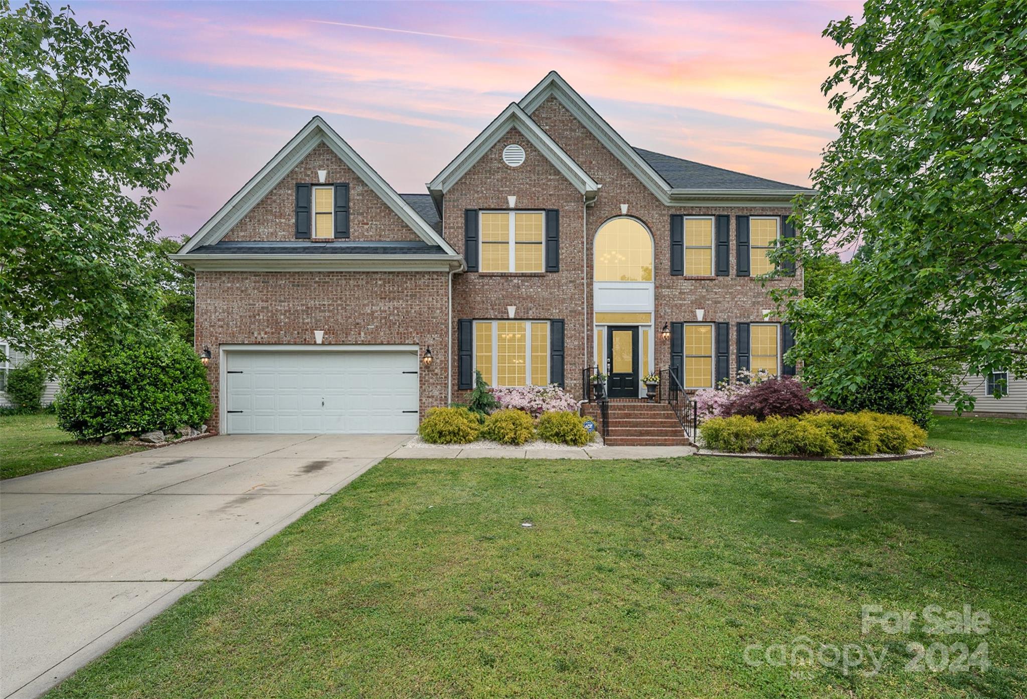 1814 Montague Road Clover, SC 29710 - Photo 1 of 33 a front view of a house with a garden and plants