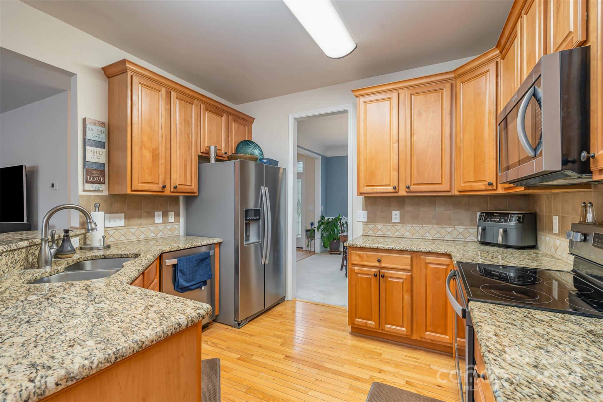 1814 Montague Road Clover, SC 29710 - Photo 13 of 33 a kitchen with stainless steel appliances granite countertop a refrigerator stove top oven sink and cabinets